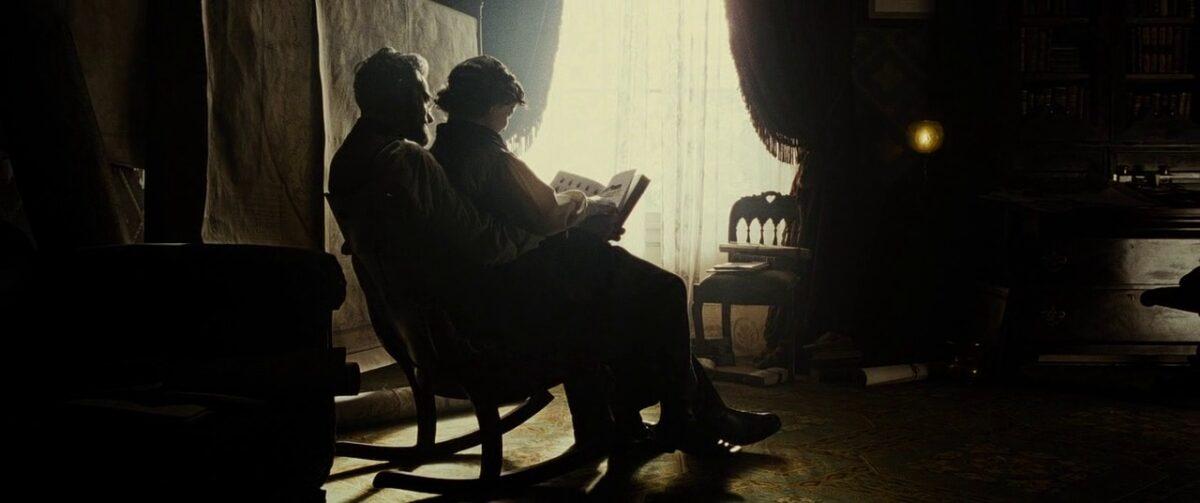President Abraham Lincoln (Daniel Day-Lewis) reads to his son in "Lincoln." (David James/DreamWorks II Distribution Co., LLC.)
