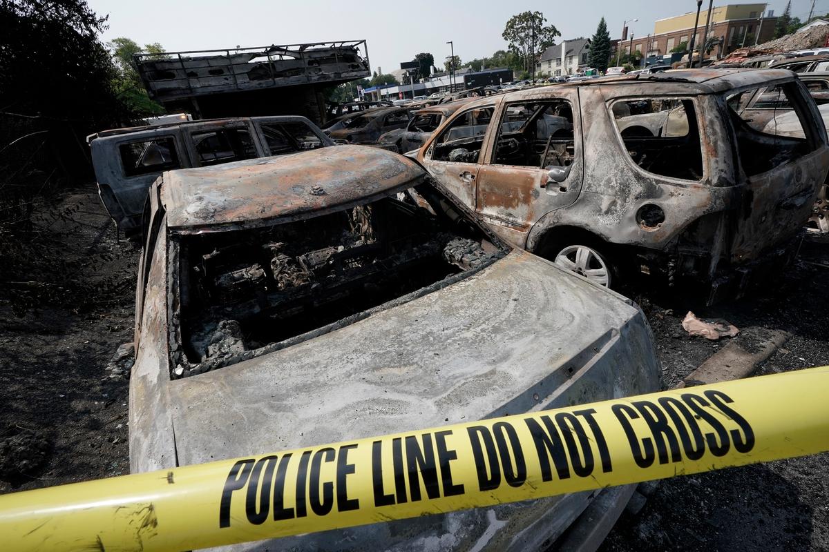 Burned out vehicles are seen after a night of riots and unrest in Kenosha, Wis., on Aug. 24, 2020. (Morry Gash/AP Photo)