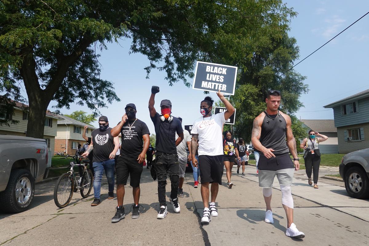 Demonstrators march in protest of last night's police shooting, in Kenosha, Wis., on Aug. 24, 2020. (Scott Olson/Getty Images)