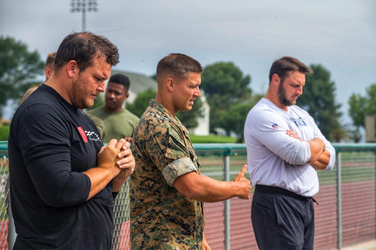 1st Lt. Quessenberry introduces his brothers, David and Scott, to members of the George Whitfield Academy on orientation day at Marine Corps Base Camp Pendleton in California, on July 18, 2019. (<a href="https://www.dvidshub.net/image/5592382/whitfield-academy-athletes-come-camp-pendleton">Ismael Pena</a>/U.S. Marine Corps)