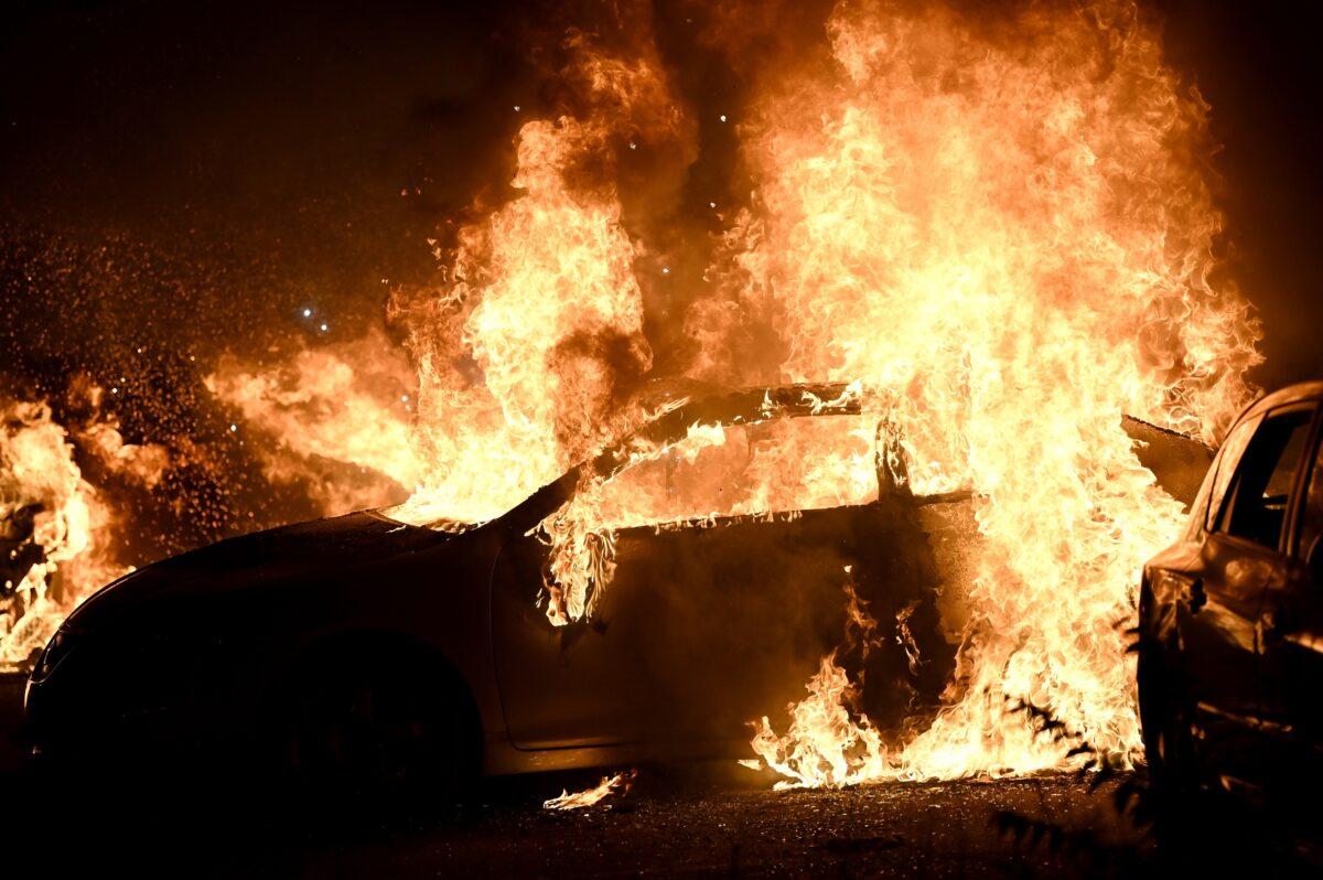 Cars burn during rioting in Kenosha, Wis., on Aug. 24, 2020. (Stephen Maturen/Reuters)