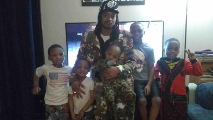 Jacob Blake, center, with his children in a file photo. (Justice for Jacob Blake/GoFundMe)