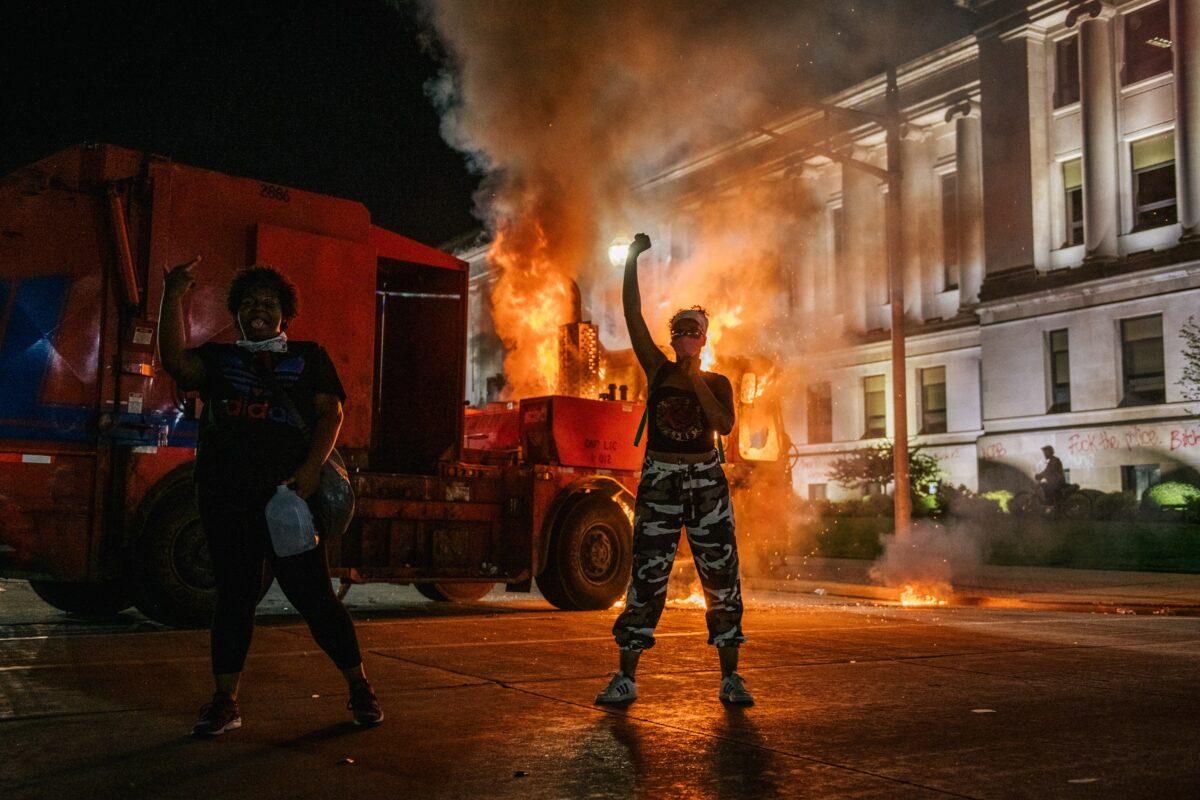 Demonstrators chant in front of a burning truck in Kenosha, Wis., on Aug. 24, 2020. (Brandon Bell/Getty Images)