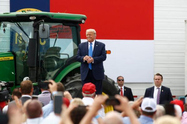President Donald Trump takes a stage to speak at Flavor 1st Growers & Packers in Mills River, North Carolina, on Aug. 24, 2020. (Brian Blanco/Getty Images)