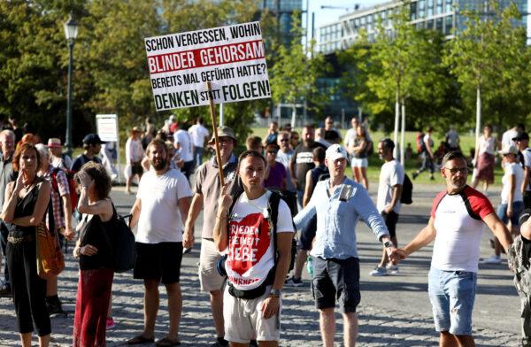 Germans take part in a protest against the government's restrictions imposed over the coronavirus outbreak, in Berlin, on Aug. 1, 2020. (Christian Mang/Reuters)