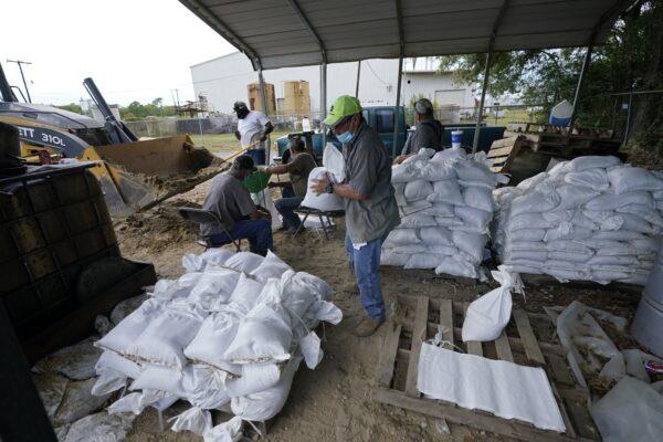 Municipal workers fill sandbags for the elderly and those with disabilities ahead of Hurricane Laura in Crowley, La., on Aug. 25, 2020. (Gerald Herbert/AP Photo)