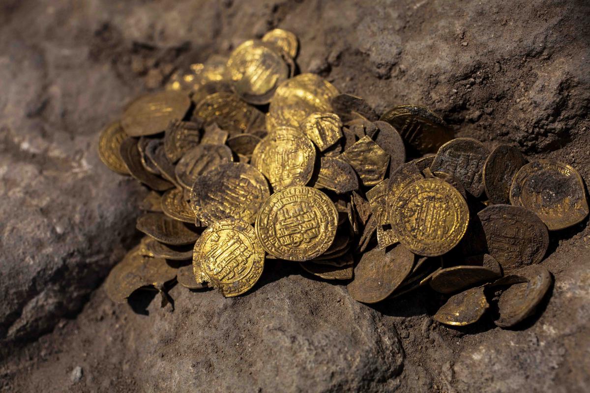 A hoard of gold coins, said by the Israel Antiquities Authority to date to the Abbasid dynasty, is seen after its discovery at an archaeological site in Central Israel Aug. 18, 2020. (Heidi Levine/Pool via REUTERS)