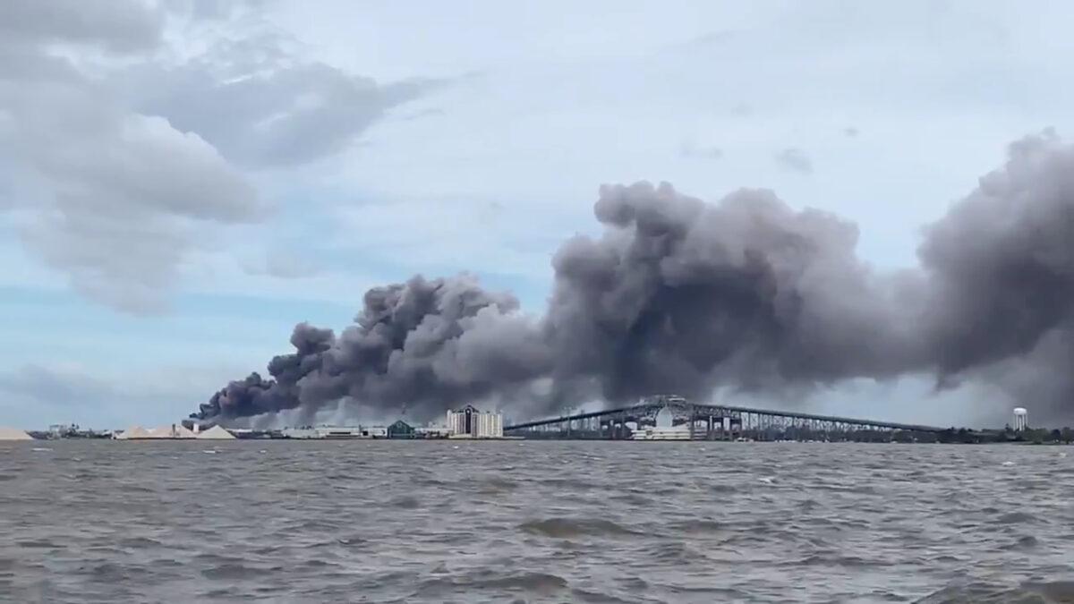 Smoke rises over Lake Charles, La., on Aug. 27, 2020, in this screen grab obtained from a social media video. (Hurricanetrack.com via Reuters)
