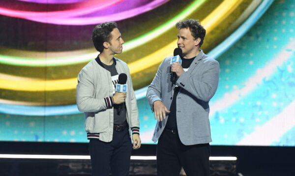 WE Charity co-founders Craig (L) and Marc Kielburger speak on stage during WE Day California at the Forum in Inglewood, Calif., on April 25, 2019. (Valerie Macon/AFP via Getty Images)