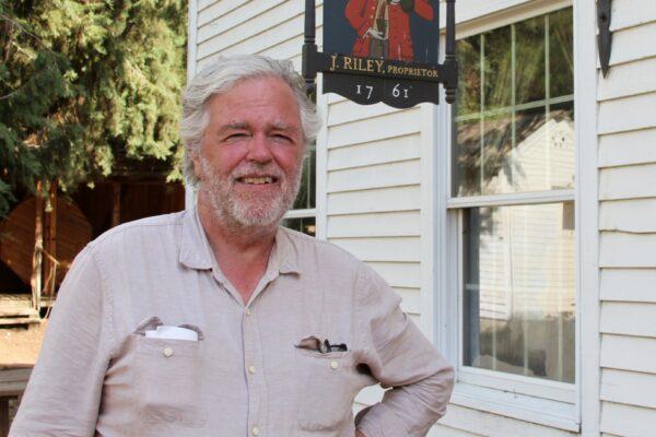 Jim Riley stands near the tavern on his farm, Riley's Farm, in Oak Glen, Calif., on Aug. 15, 2020. (Brad Jones/The Epoch Times)
