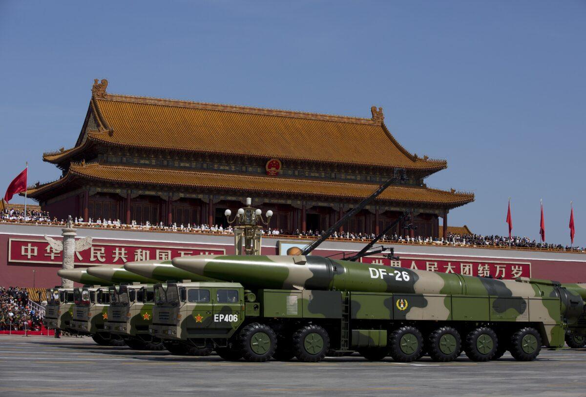 Chinese military vehicles, carrying DF-26 ballistic missiles, drive past Tiananmen Square during a military parade in Beijing, China, on Sept. 3, 2015. (Andy Wong/Pool/Getty Images)
