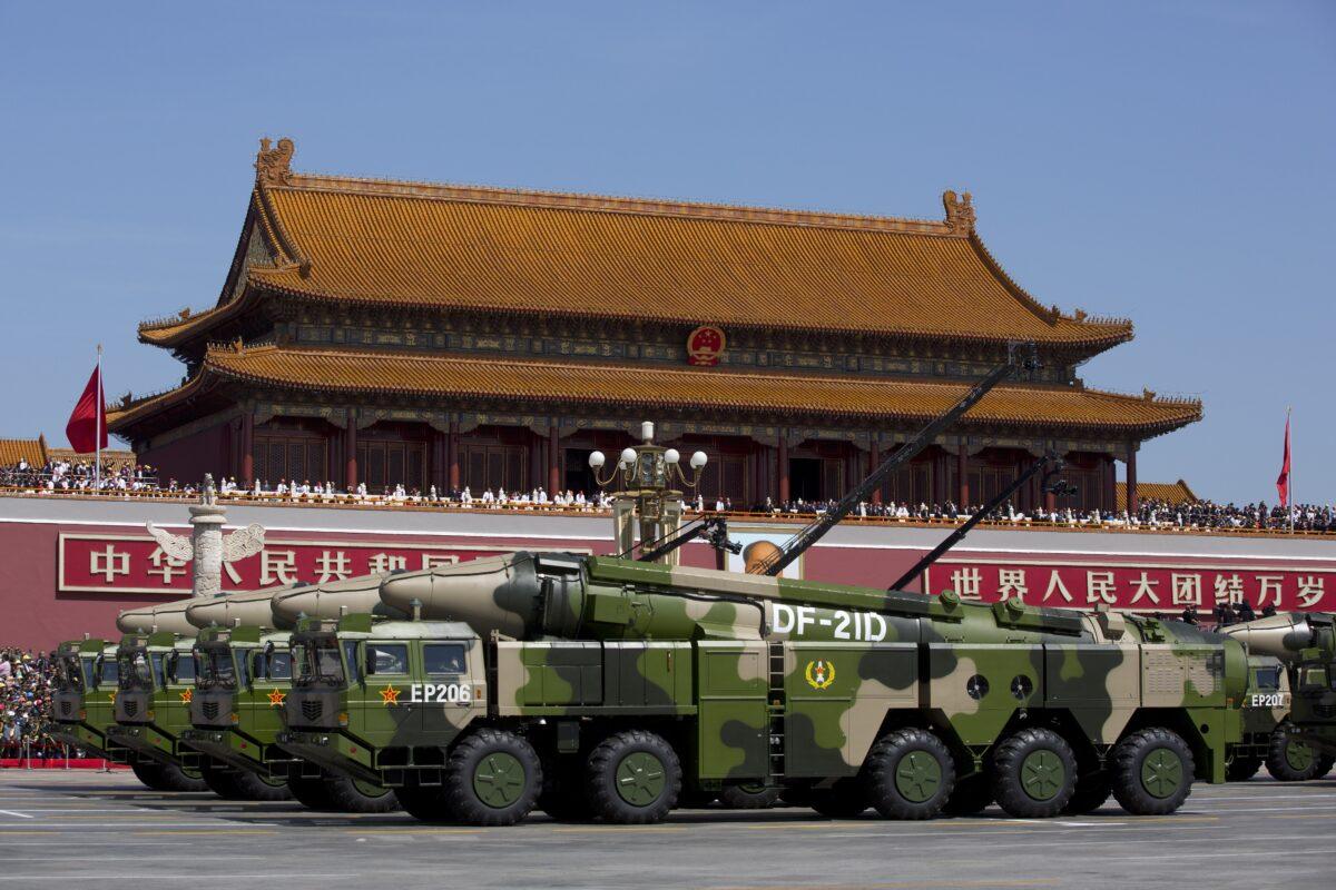 Chinese military vehicles, carrying DF-21D anti-ship ballistic missiles, drive past Tiananmen Square during a military parade in Beijing, China, on Sept. 3, 2015. (Andy Wong/Pool/Getty Images)