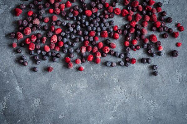 Freeze delicate produce, such as berries, on a baking sheet in a single layer before transferring to freezer bags. (Flaffy/Shutterstock) or (Alena Brozova/Shutterstock)