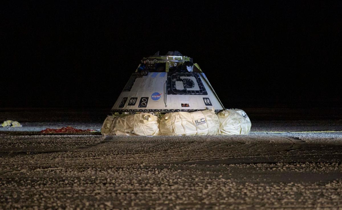 In this NASA handout, the Boeing CST-100 Starliner spacecraft is seen after it landed in White Sands, New Mexico, Sunday, Dec. 22, 2019. (Bill Ingalls/NASA via Getty Images)