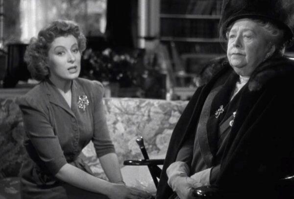 Mrs. Miniver (Greer Garson, L) may not be upper crust like Lady Beldon (Dame May Whitty), but they find they do have much in common, in “Mrs. Miniver.”  (MGM)