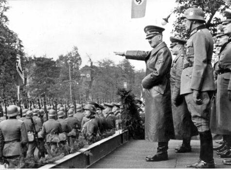German troops parade in front of Adolf Hitler and Nazi generals in Warsaw on Oct. 5, 1939, a month after the invasion of Poland that began the Second World War. (Public Domain)