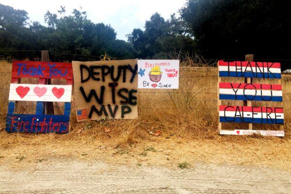 Signs along Route 68 to Carmel Valley, Calif., show support for firefighters on Aug. 26, 2020. (Ilene Eng/The Epoch Times)