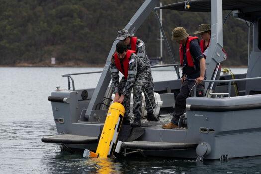 Australian Mine Warfare Team 16, MCDGRP, and DSTG staff operating the Bluefin 9 Autonomous Underwater Vehicle (AUV) from a Mine Countermeasure Support Boat (MCMSB) at Pittwater, NSW on Feb. 5, 2020. (Australian Department of Defence)