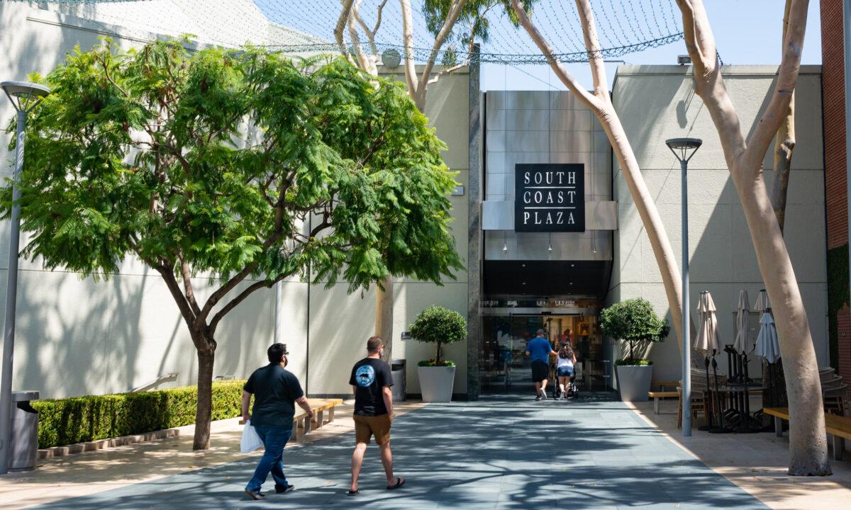 Customers enter the South Coast Plaza shopping mall in Costa Mesa, Calif., on Aug. 31, 2020. (John Fredricks/The Epoch Times)