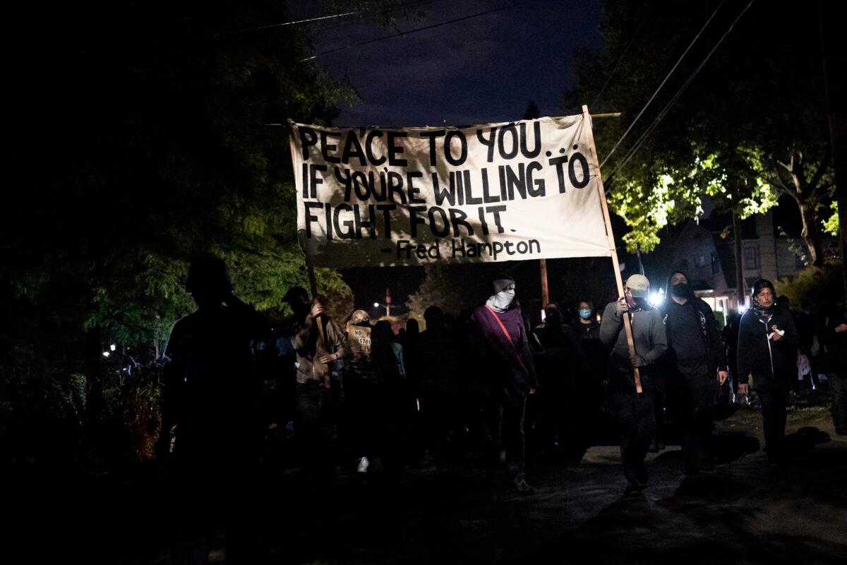 Demonstrators march in Portland, Ore., on Aug. 30, 2020. (Nathan Howard/Getty Images)