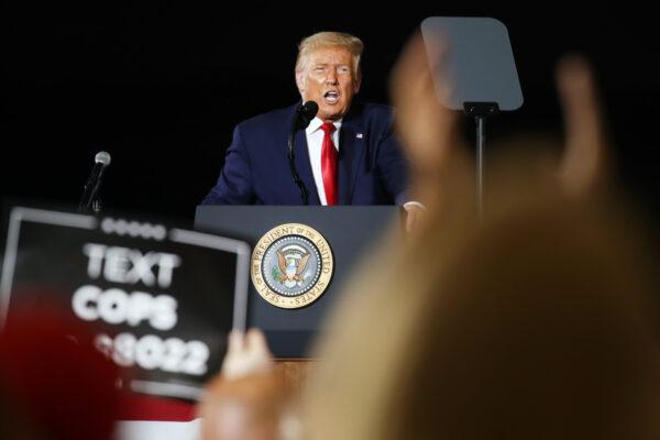 Then-President Donald Trump speaks at an airport hanger at a rally a day after he formally accepted his party’s nomination at the Republican National Convention in Londonderry, N.H., on Aug. 28, 2020. (Spencer Platt/Getty Images)