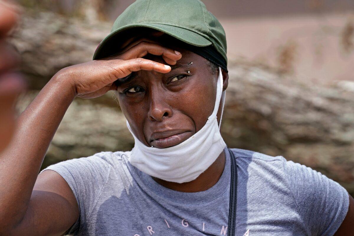 Linda Smoot, who evacuated from Hurricane Laura in a pickup truck with eight others, reacts as they return to see their homes, in Lake Charles, La., on Aug. 30, 2020. (Gerald Herbert/AP Photo)