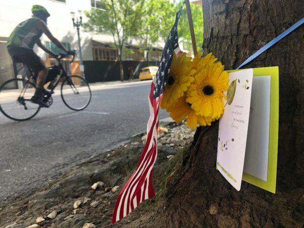 A small memorial to the fatal shooting victim, 39-year old Aaron J. Danielson, is shown at the site where he was killed in Portland, Ore., on Aug. 31, 2020. (Gillian Flaccus/AP Photo)