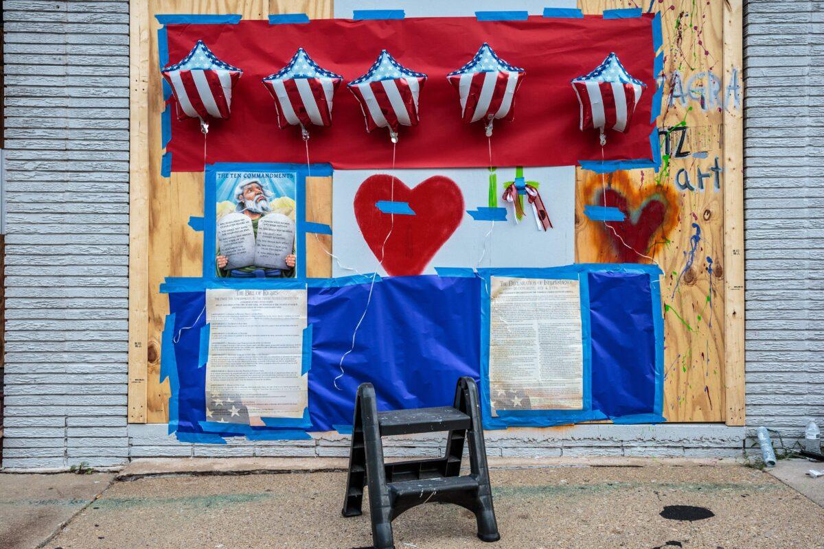 The Bill of Rights, Ten Commandments, the Declaration of Independence, and decorative balloon on a boarded up store in Kenosha, Wis., on Aug. 31, 2020. (Kerem Yucel/AFP via Getty Images)