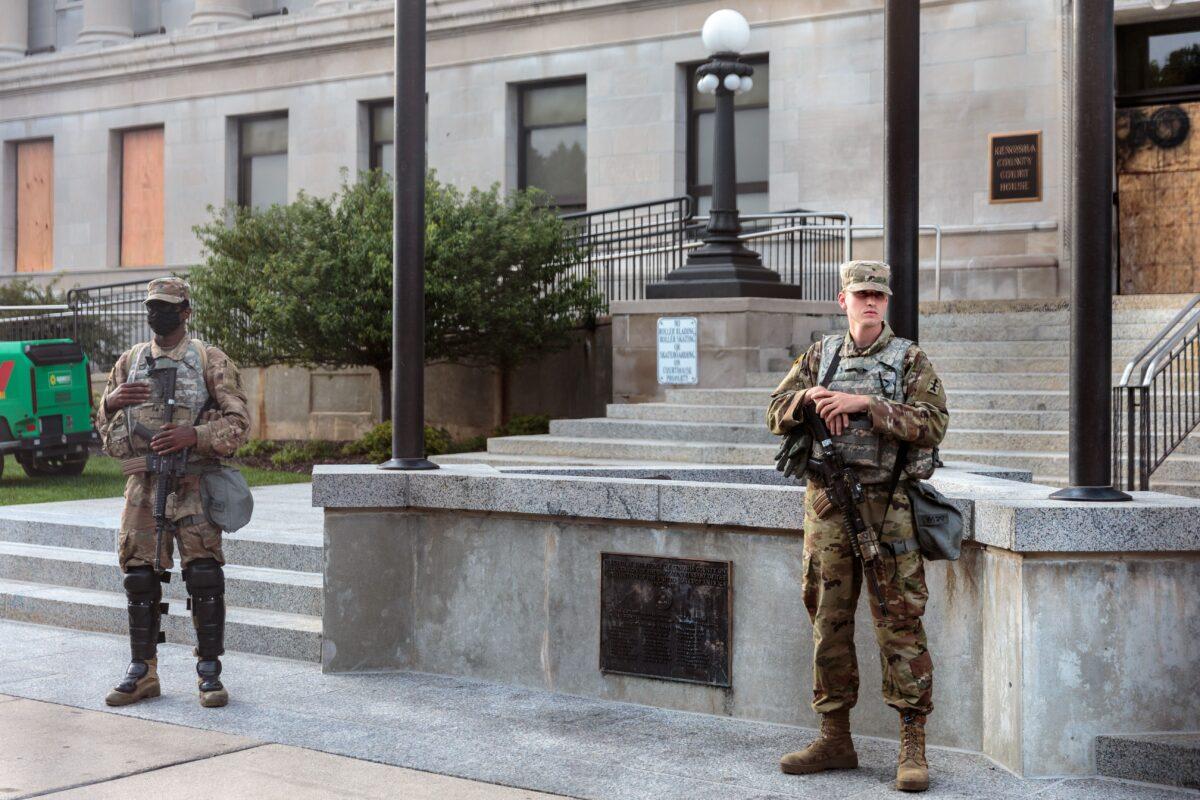 Two cadet National Guardsmen stand outside the Kenosha Courthouse during curfew in Kenosha, Wis., on Aug. 31, 2020. (Kerem Yucel/AFP via Getty Images)