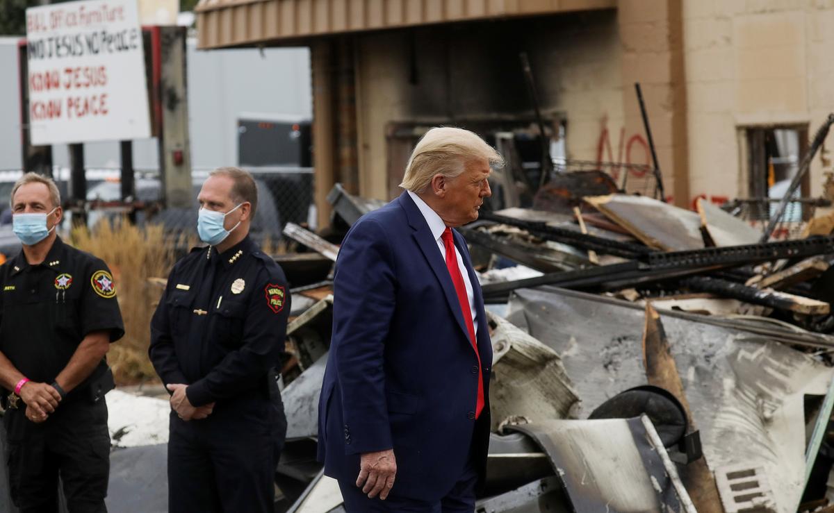 President Donald Trump views property damaged during riots in Kenosha, Wis., on Sept. 1, 2020. (Leah Millis/Reuters)