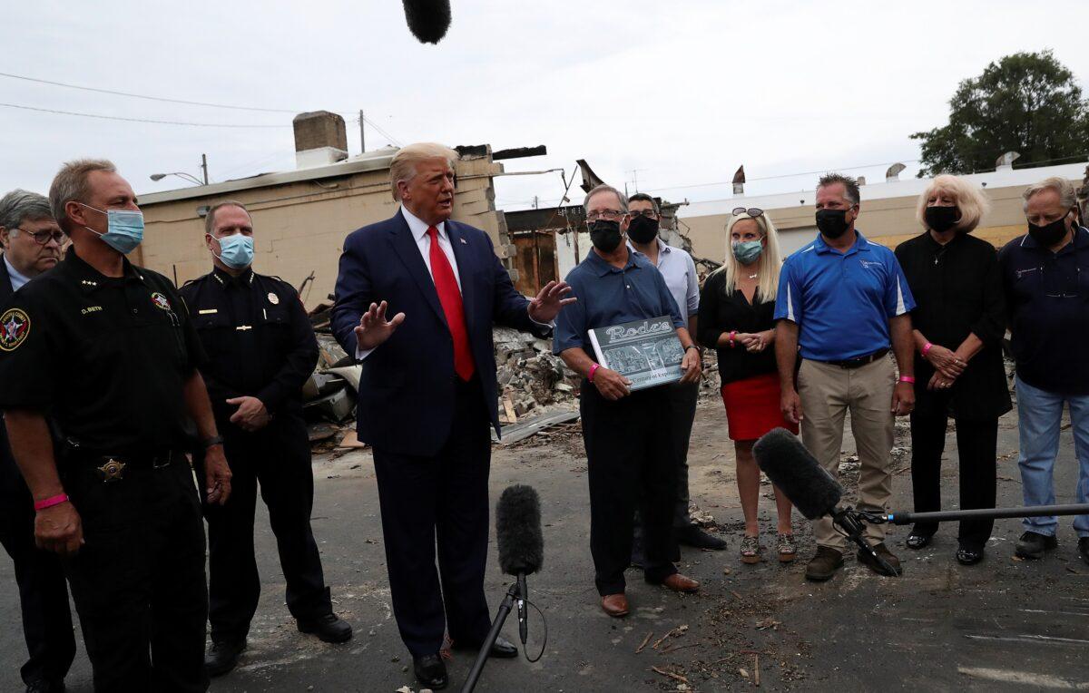 President Donald Trump speaks while viewing property damage during a visit in the aftermath of riots in Kenosha, Wis., on Sept. 1, 2020. (Leah Millis/Reuters)
