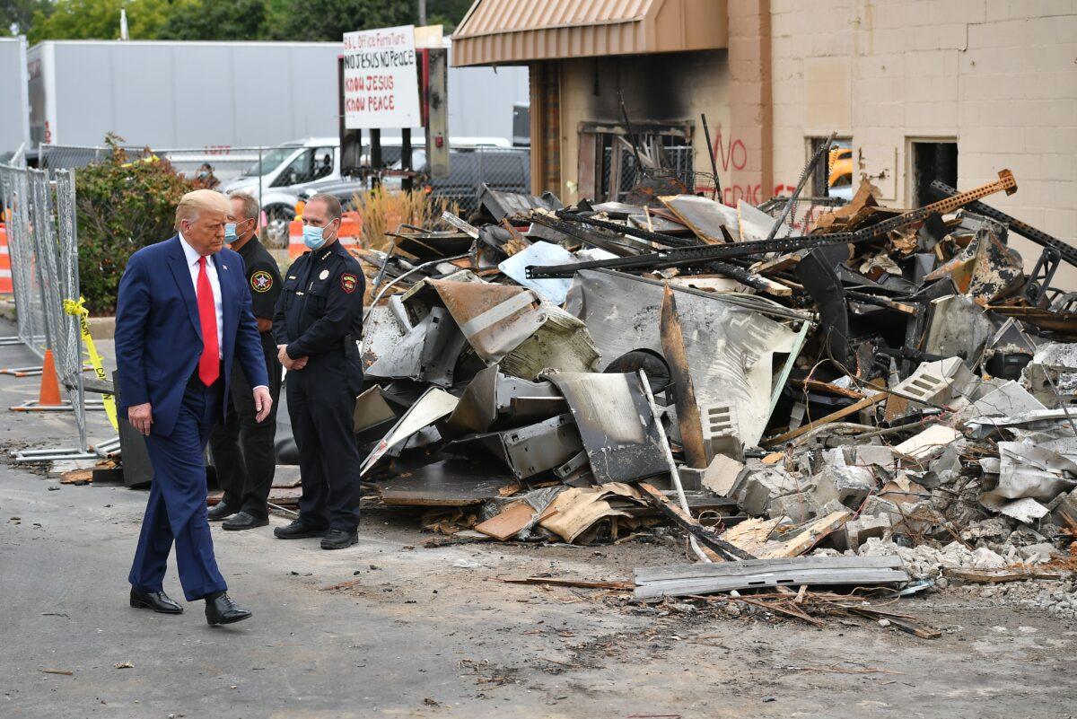 President Donald Trump views property damaged during riots in Kenosha, Wis., on Sept. 1, 2020. (Mandel Ngan/AFP via Getty Images)