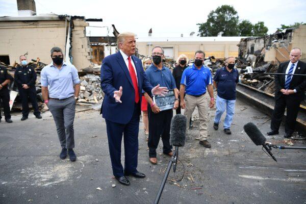 President Donald Trump speaks to the press as he tours an area affected by civil unrest, in Kenosha, Wis., on Sept. 1, 2020. (Mandel Ngan/AFP via Getty Images)