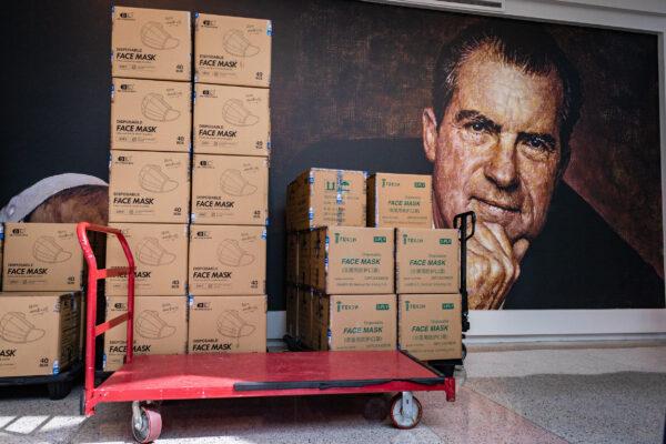 Stacks of boxes containing donated face masks wait for pick up in the lobby of the Richard Nixon Foundation in Yorba Linda, Calif., on Sept. 1, 2020. (John Fredricks/The Epoch Times)