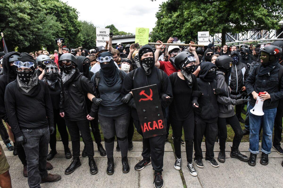 Antifa members line up to challenge a rally in Portland, Ore., on Aug. 17, 2019. (Stephanie Keith/Getty Images)
