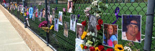 Pictures of people who died from a drug overdose line a fence at the Laguna Niguel Skate Park in Laguna Niguel, Calif., on Aug. 31, 2020. (Chris Karr/The Epoch Times)