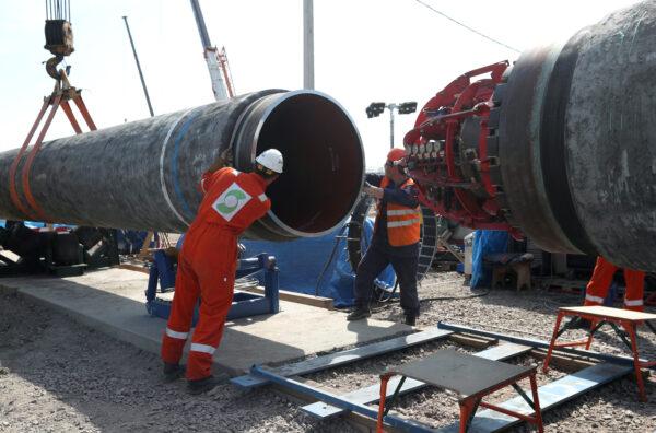 Workers are seen at the construction site of the Nord Stream 2 gas pipeline, near the town of Kingisepp, Leningrad region, Russia, on June 5, 2019. (Anton Vaganov/Reuters)