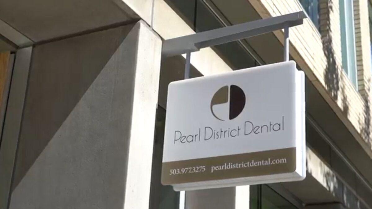 In this still image from video, the sign for Pearl District Dental is seen in Portland, Ore., on Sept. 2, 2020. (Roman Balmakov/The Epoch Times)