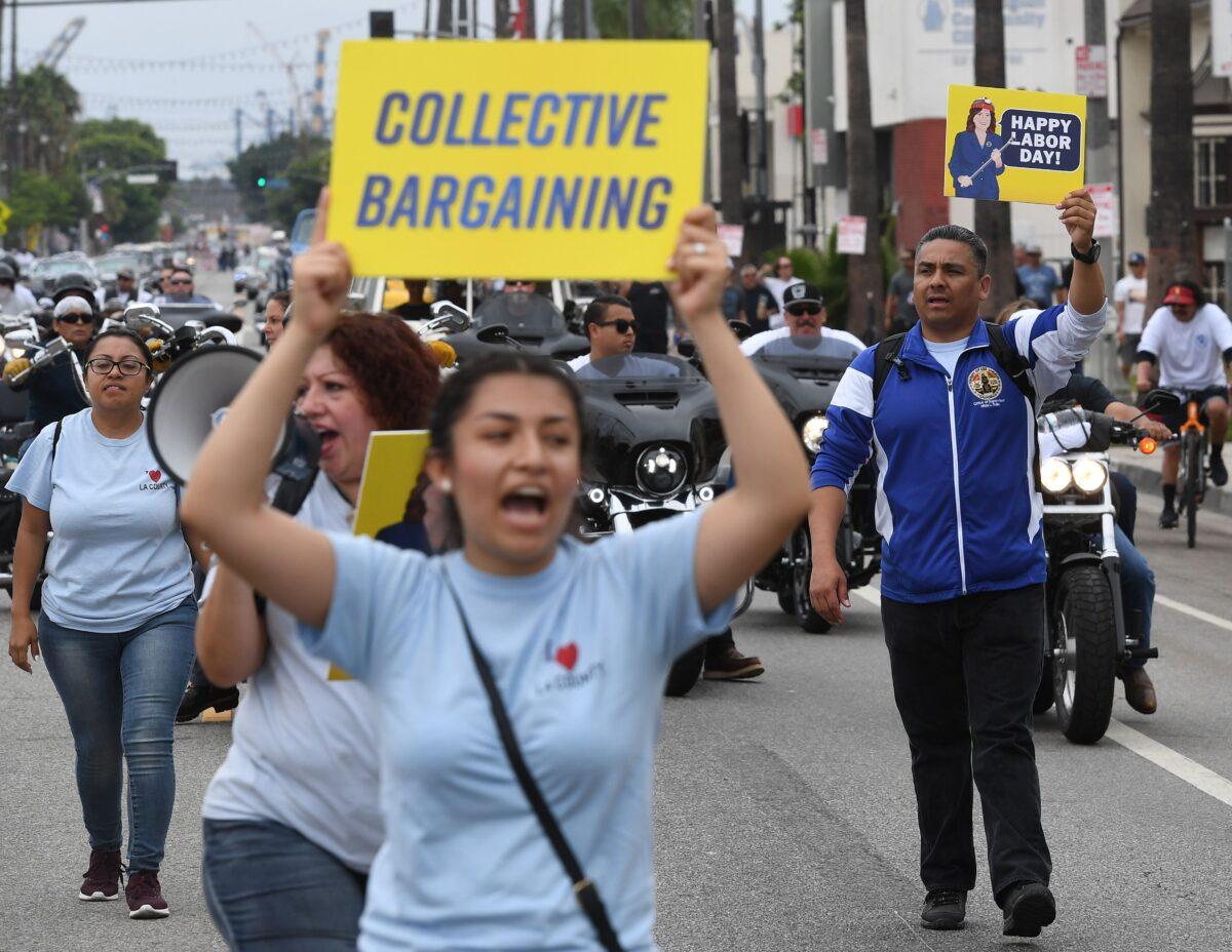 Union members and their families, march through the streets during the annual Labor Day parade and rally in Long Beach, Calif., on Sept. 3, 2018. (Mark Ralston/AFP via Getty Images)