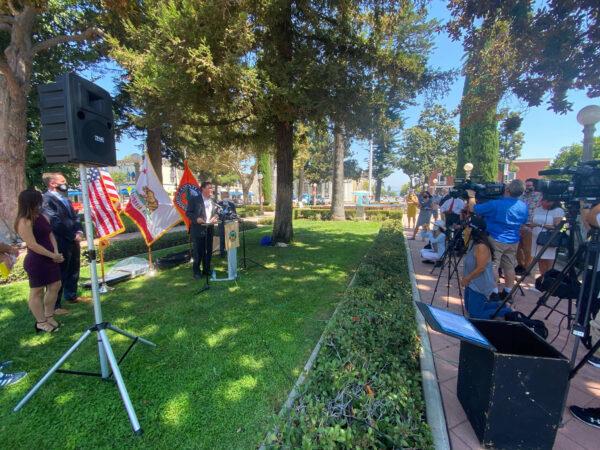Orange County officials gather for a news conference in Plaza Park in Orange, Calif., on Sept. 4, 2020. (Drew Van Voorhis/The Epoch Times)