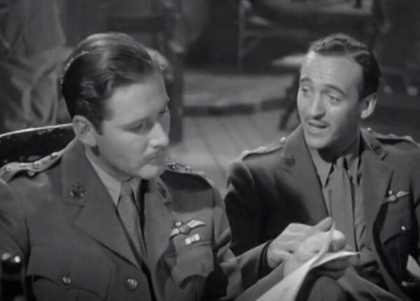 Errol Flynn (L) and David Niven play Royal Flying Corps buddies in “The Dawn Patrol.” (Warner Bros.)