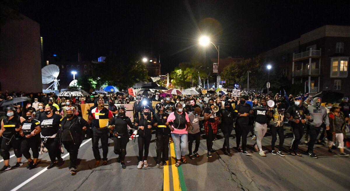 Demonstrators march through the streets protesting the death of Daniel Prude in Rochester, N.Y., on Friday, Sept. 4, 2020. (Adrian Kraus/AP Photo)