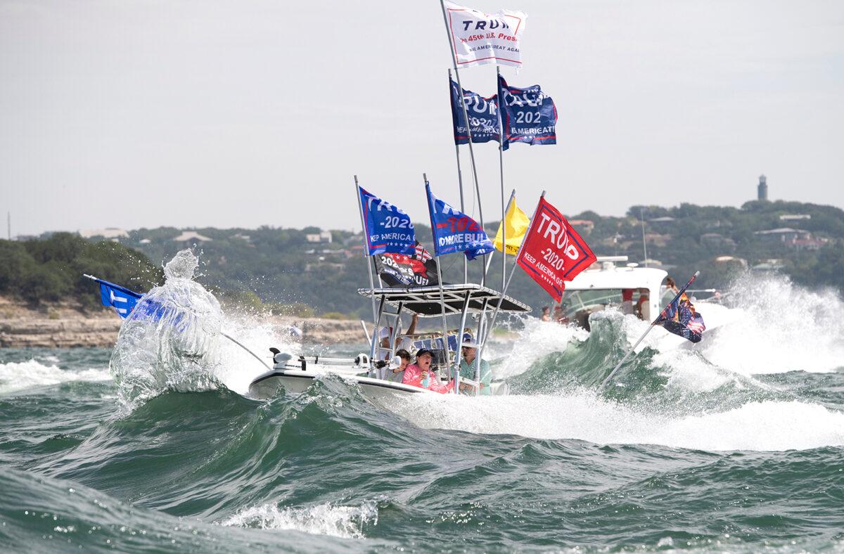 Boaters flying flags honoring President Donald Trump crowd Lake Travis in Lakeway, Texas, during a boat parade that attracted hundreds of watercraft of all sizes, on Sept. 5, 2020. (Bob Daemmrich via AP)