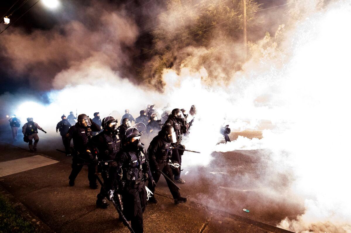 Police use chemical irritants and crowd control munitions to disperse rioters, in Portland, Ore., Sept. 5, 2020. (Noah Berger/AP Photo)