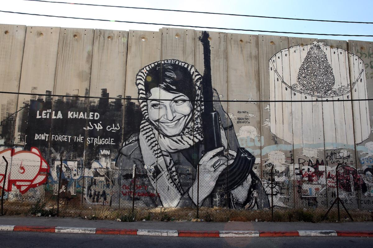 The Leila Khaled mural on the Apartheid Wall at Bethlehem in central West Bank on June 16, 2013. (Ian Walton/Getty Images)