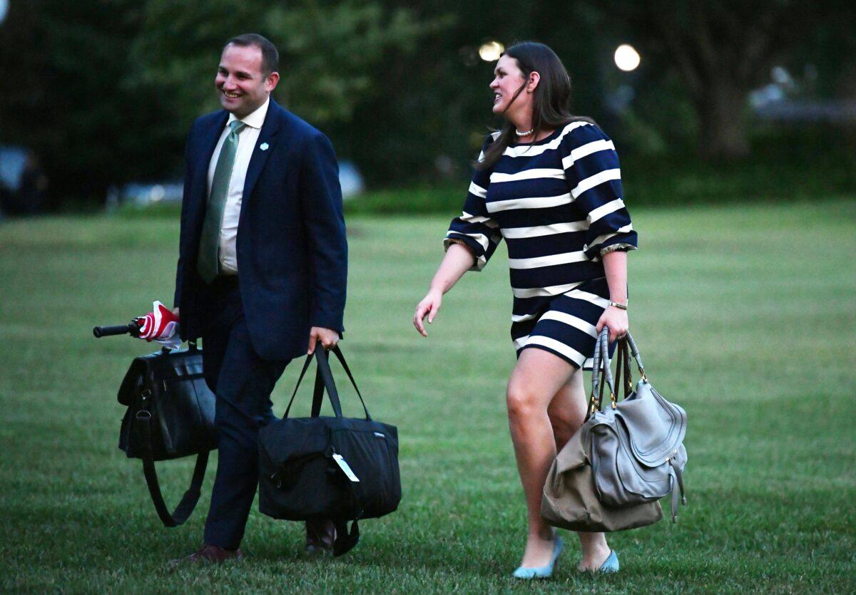 White House Deputy Chief of Staff Zach Fuentes, left, walks with White House press secretary Sarah Sanders in Washington on Aug. 13, 2018. (Mandel Ngan/AFP via Getty Images)