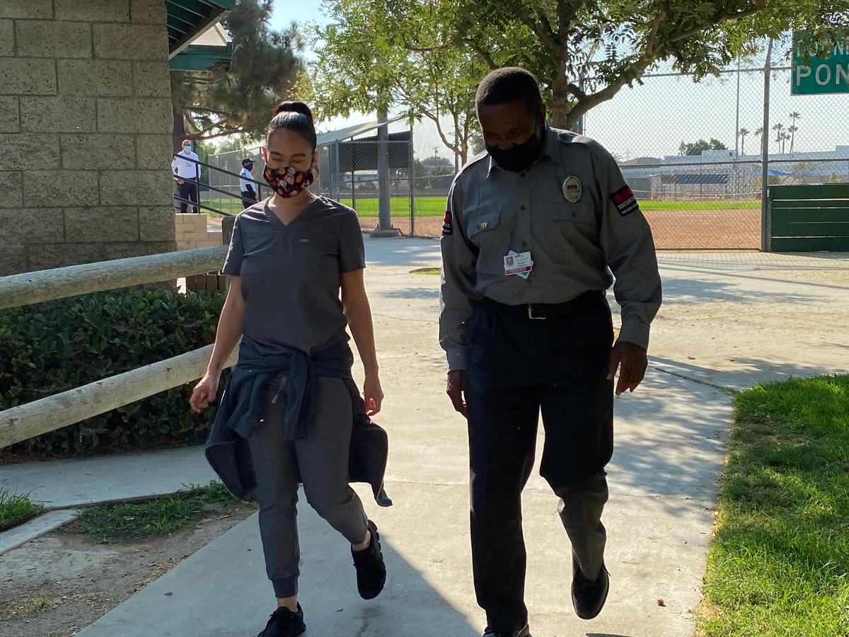 Registered nurse Kelly Wilson with a security officer and former Marine, Robert Johnson. (Courtesy of Steph Elam)