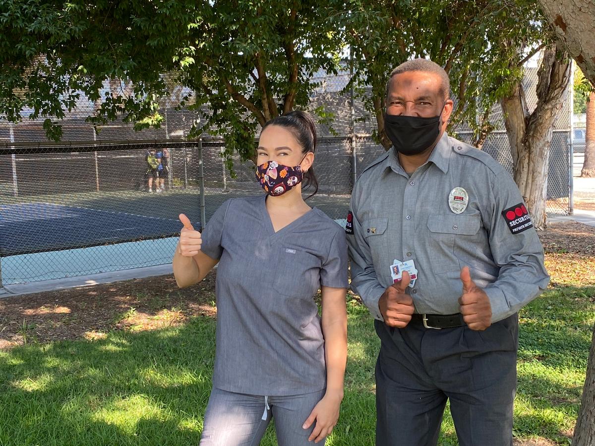 Registered nurse Kelly Wilson with security officer and former Marine Robert Johnson, who cheers nurses caring for Covid-19 patients. (Courtesy of Stephanie Elam)