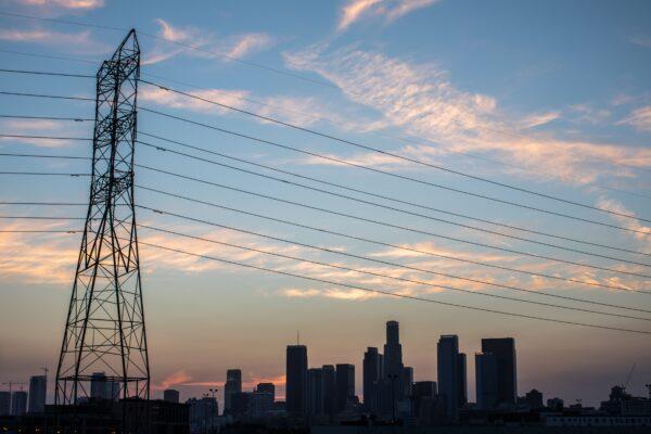 The downtown skyline is seen behind high tension towers in Los Angeles on Aug. 16, 2020. (Apu Gomes/AFP via Getty Images)