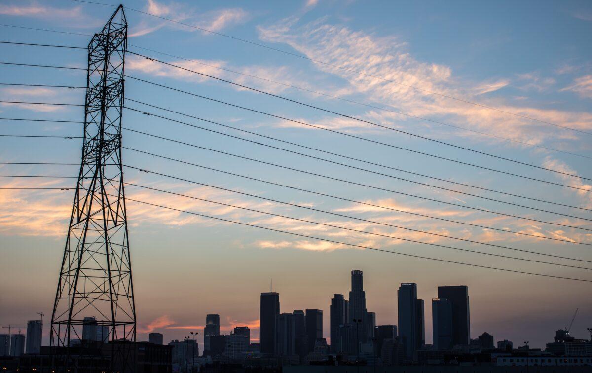 The downtown skyline is seen behind high tension towers in Los Angeles on Aug. 16, 2020. (Apu Gomes/AFP via Getty Images)